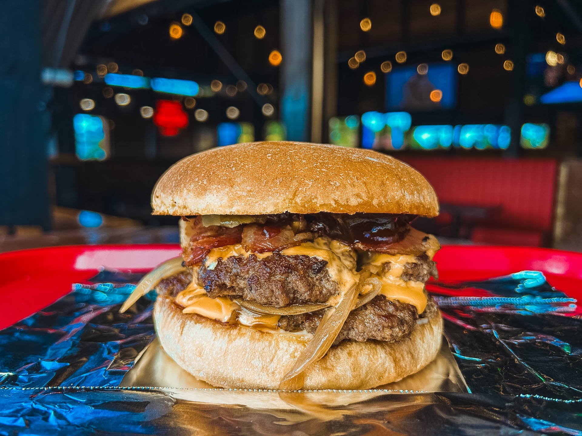 Double cheese and bacon smash burger with caramelised onions and secret sauce
